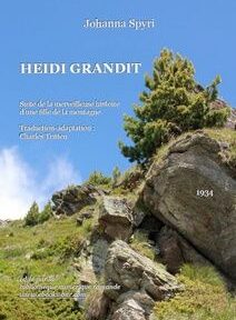 Couverture du livre « Heidi Grandit » de Johanna Spyri, représentant une colline rocheuse avec des pins sur fond de ciel bleu. Le texte comprend le nom de l'auteur, le titre du livre et l'année 1934.